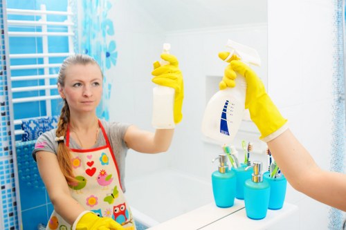 Professional cleaners working in a Finsbury Park home interior