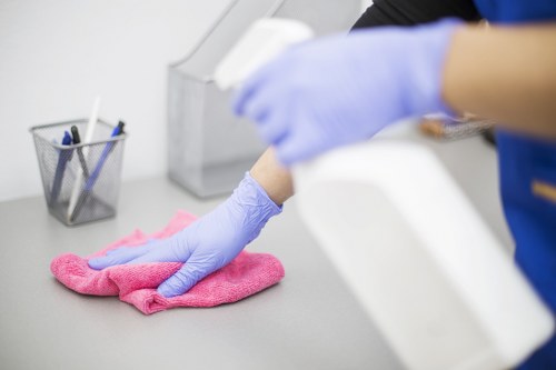 Move in cleaning in an empty home with dusting and wiping surfaces