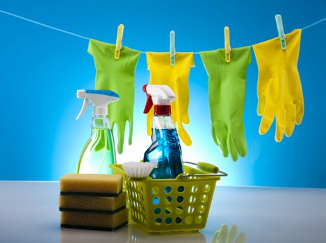 Professional upholstery cleaning equipment in use on a fabric chair